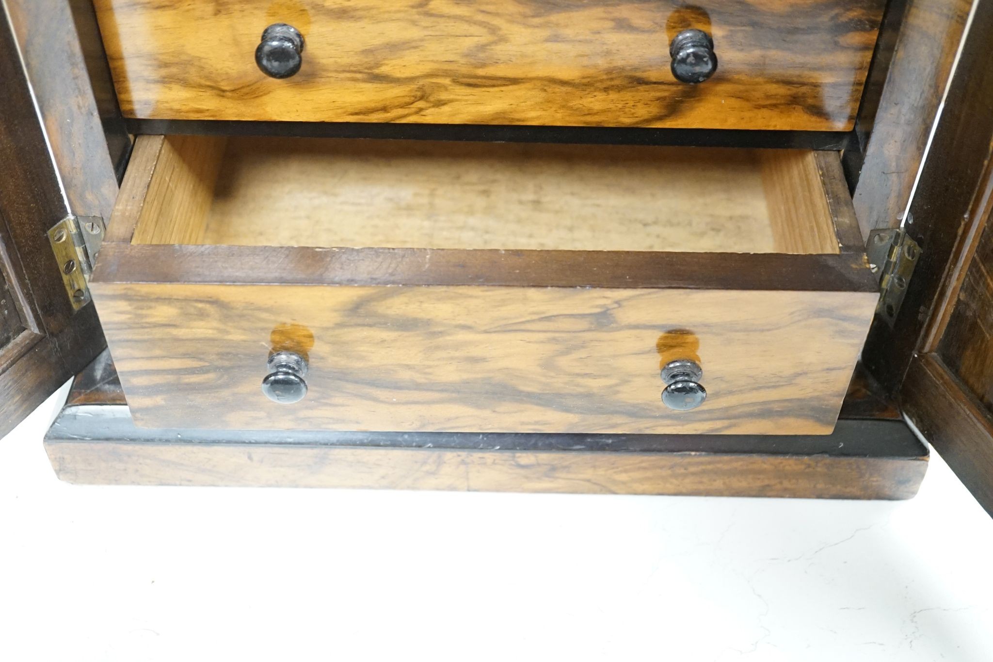 A Victorian walnut collector’s cabinet of drawers and adjustable book trough made out of ‘mahogany from the popular pleasure steamer “La Marguerite” dismantled 1926’